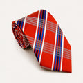 A rolled George Neale orange and blue plaid silk tie.