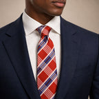 Orange and Blue Plaid Silk Tie by George Neale, worn by a model with a suit and shirt