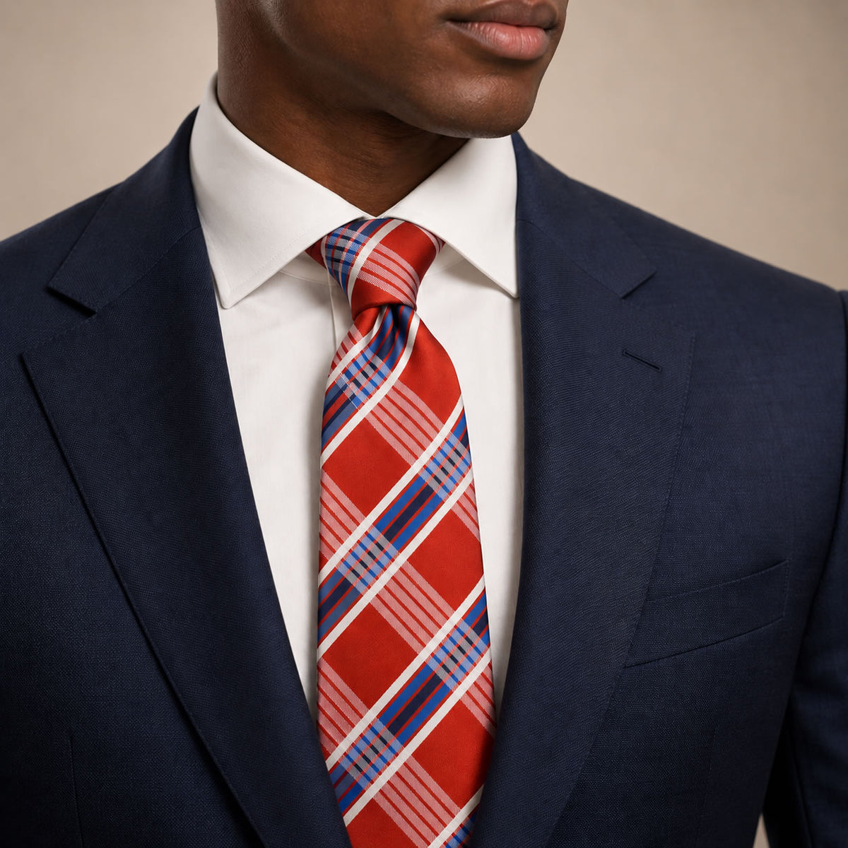 Orange and Blue Plaid Silk Tie by George Neale, worn by a model with a suit and shirt