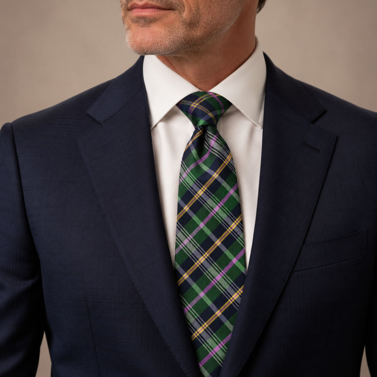 Green and Pink Plaid Silk Tie by George Neale, worn by a model with a suit and shirt
