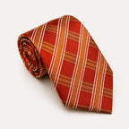 A rolled George Neale orange and gold plaid silk tie.