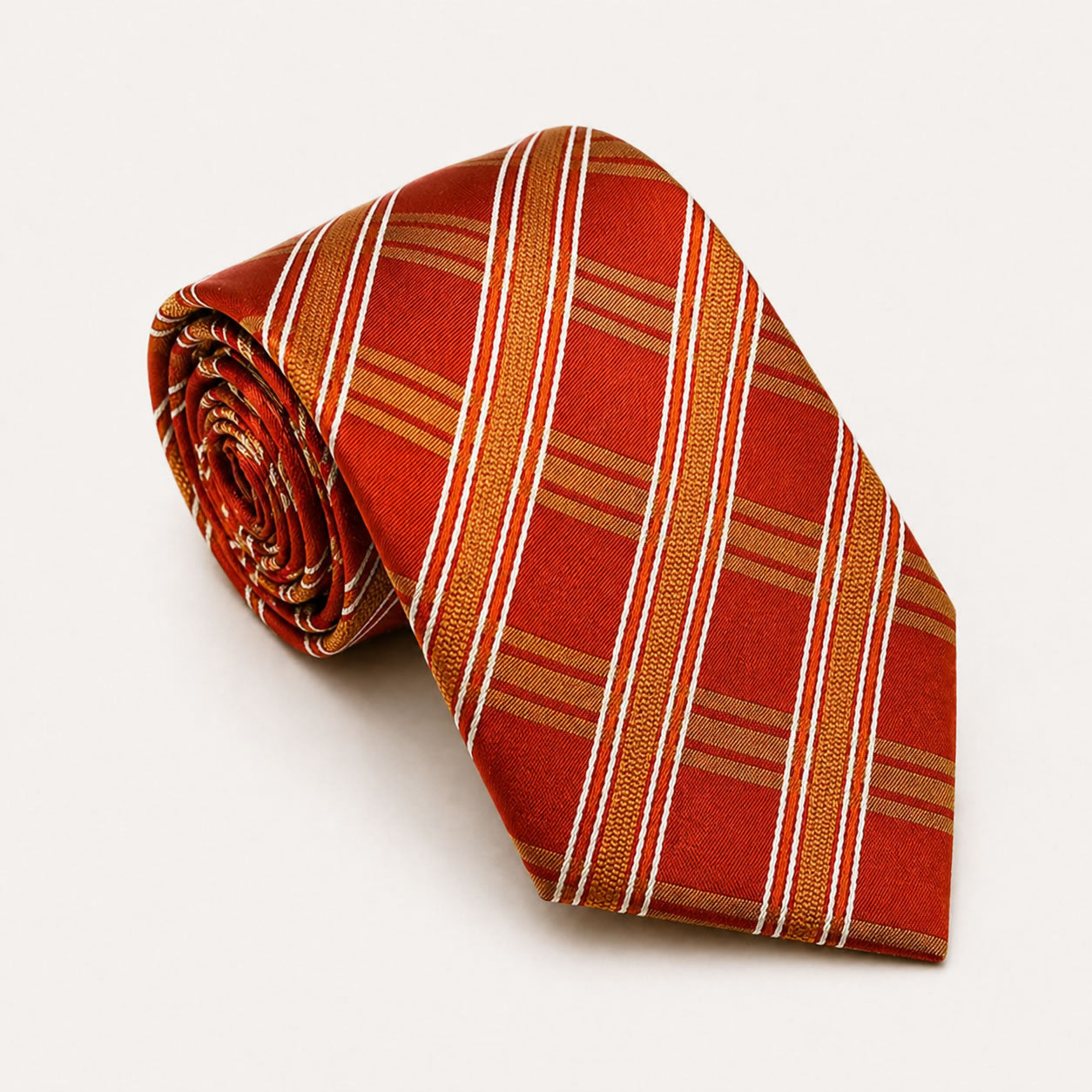 A rolled George Neale orange and gold plaid silk tie.