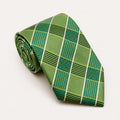A rolled George Neale green and white plaid silk tie.