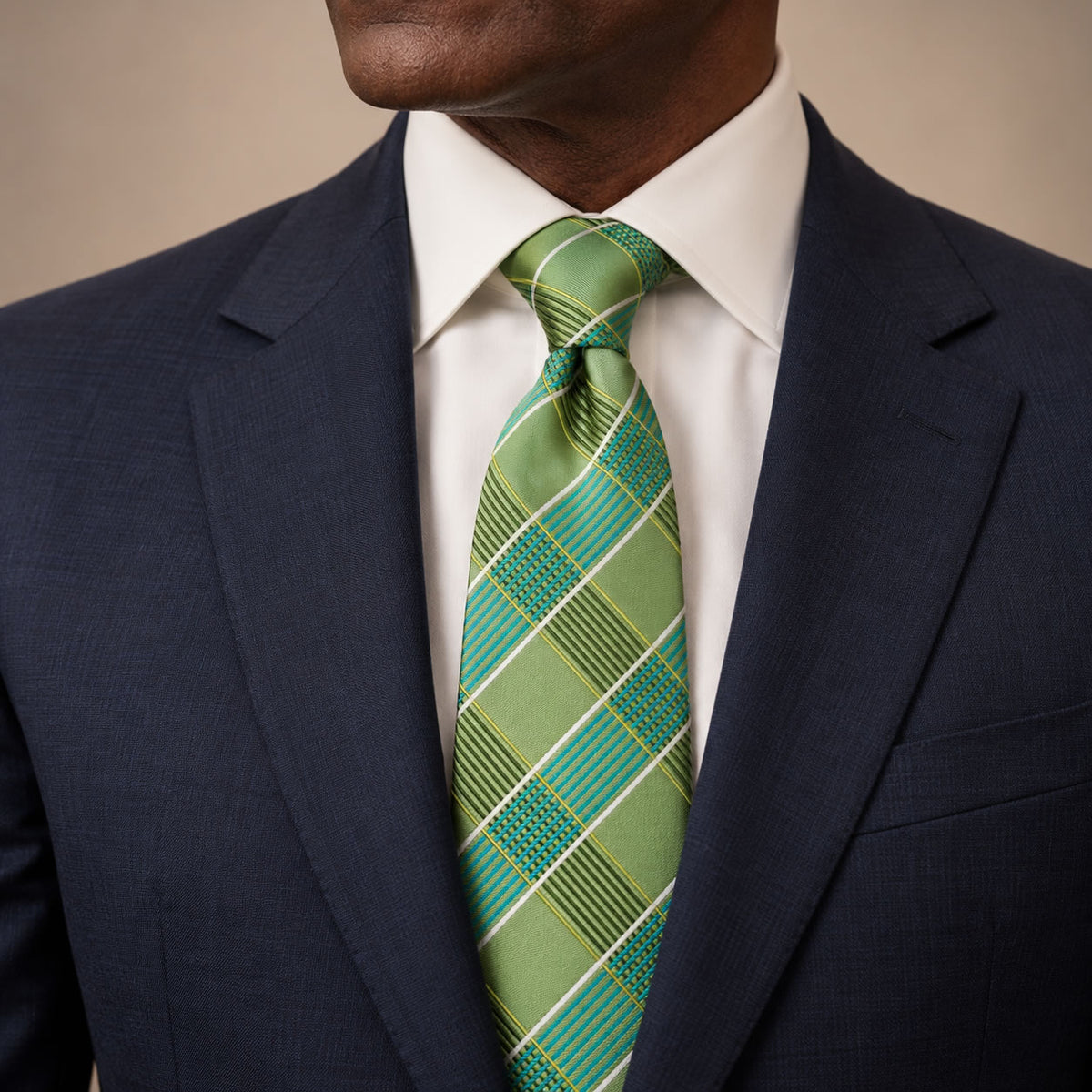 Green and White Plaid Silk Tie by George Neale, worn by a model with a suit and shirt