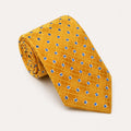 A rolled George Neale gold and blue plaid silk tie.