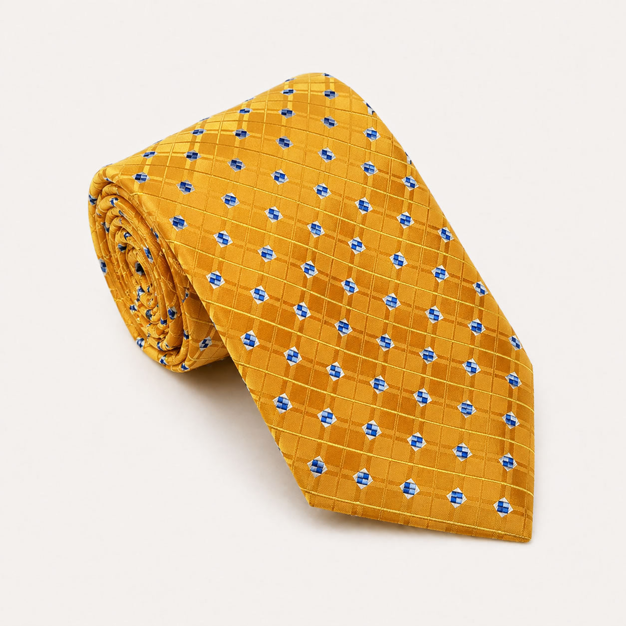 A rolled George Neale gold and blue plaid silk tie.