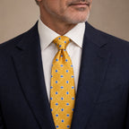Gold and Blue Plaid Silk Tie by George Neale, worn by a model with a suit and shirt