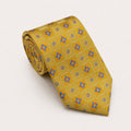 A rolled George Neale gold and blue plaid silk tie.