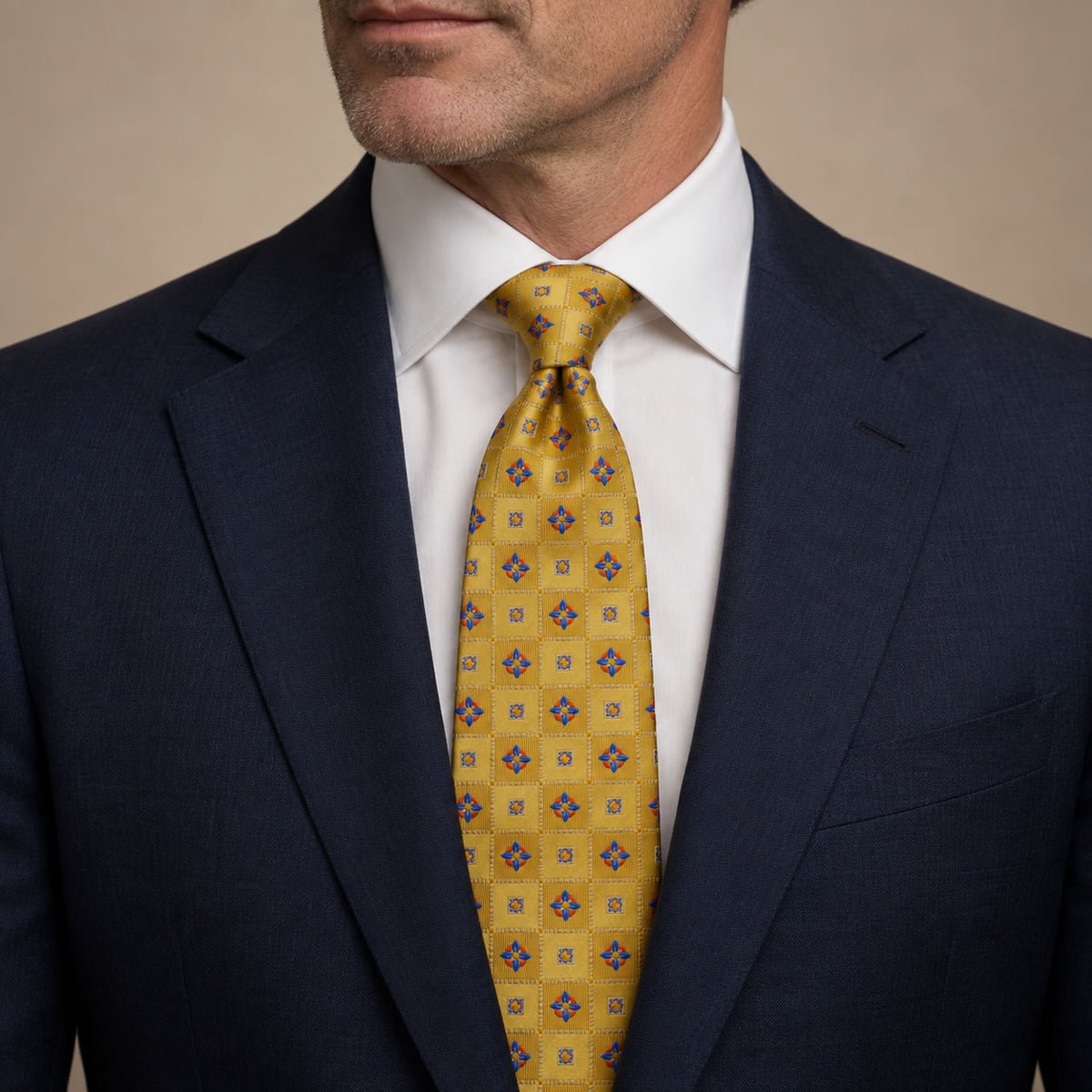 Gold and Blue Plaid Silk Tie by George Neale, worn by a model with a suit and shirt