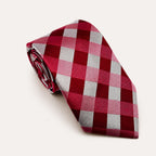 A rolled George Neale red and silver plaid silk tie.