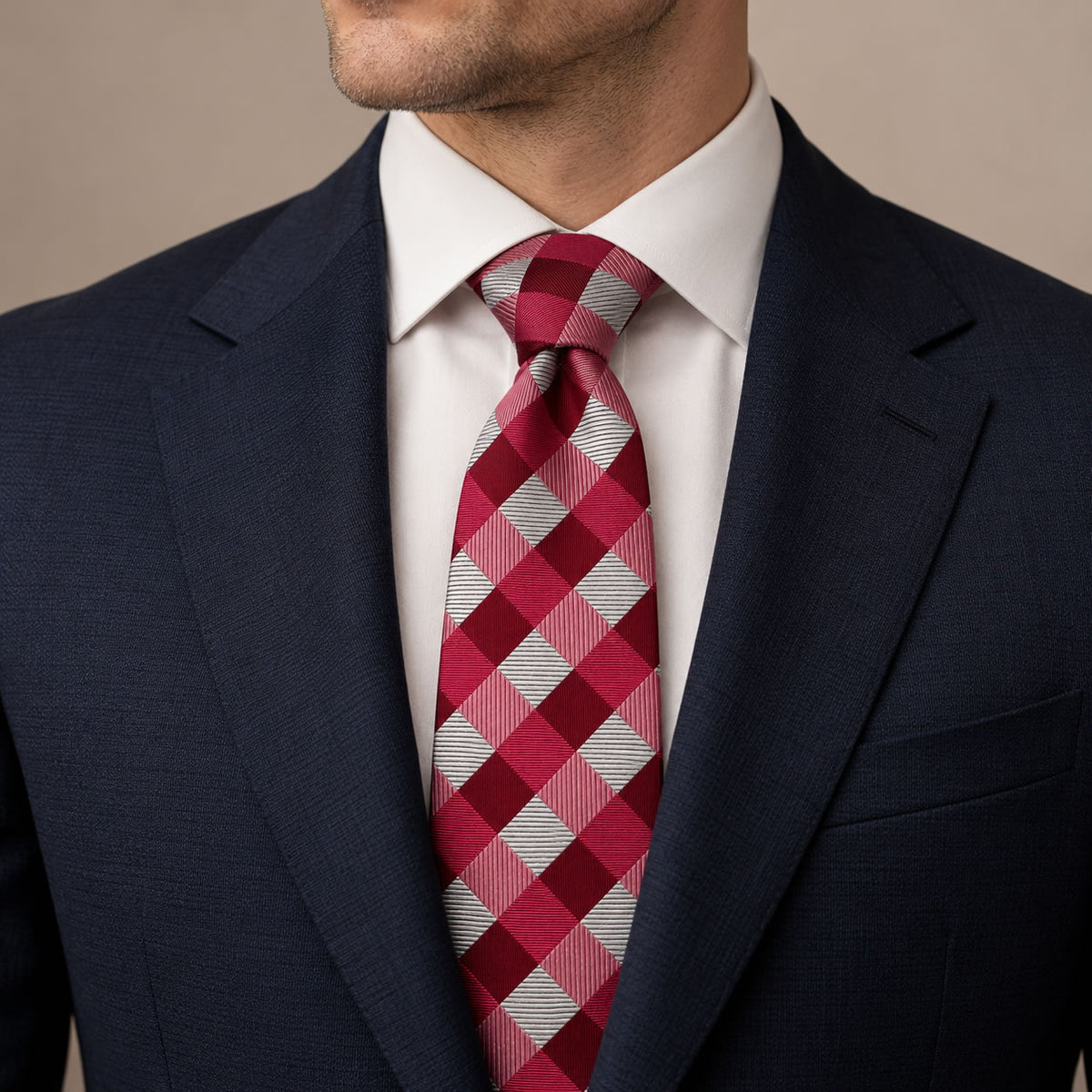 Red and Silver Plaid Silk Tie by George Neale, worn by a model with a suit and shirt