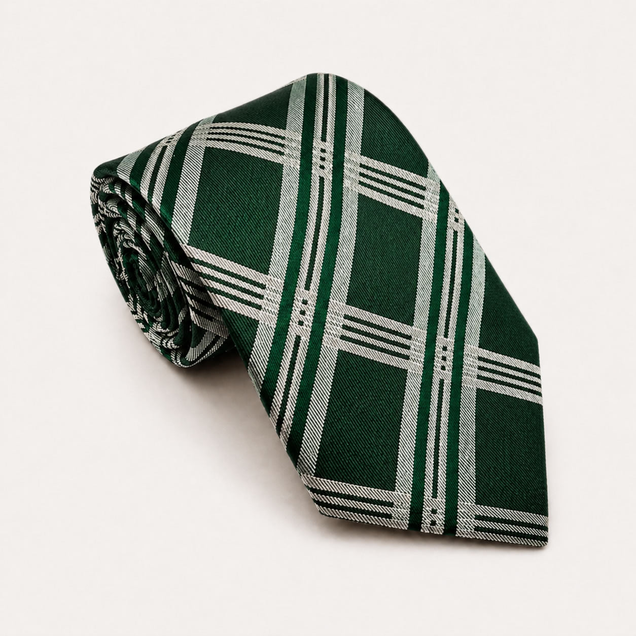A rolled George Neale dark green and silver plaid silk tie.