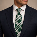 Dark Green and Silver Plaid Silk Tie by George Neale, worn by a model with a suit and shirt