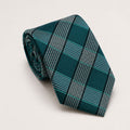 A rolled George Neale dark aquamarine and silver plaid silk tie.