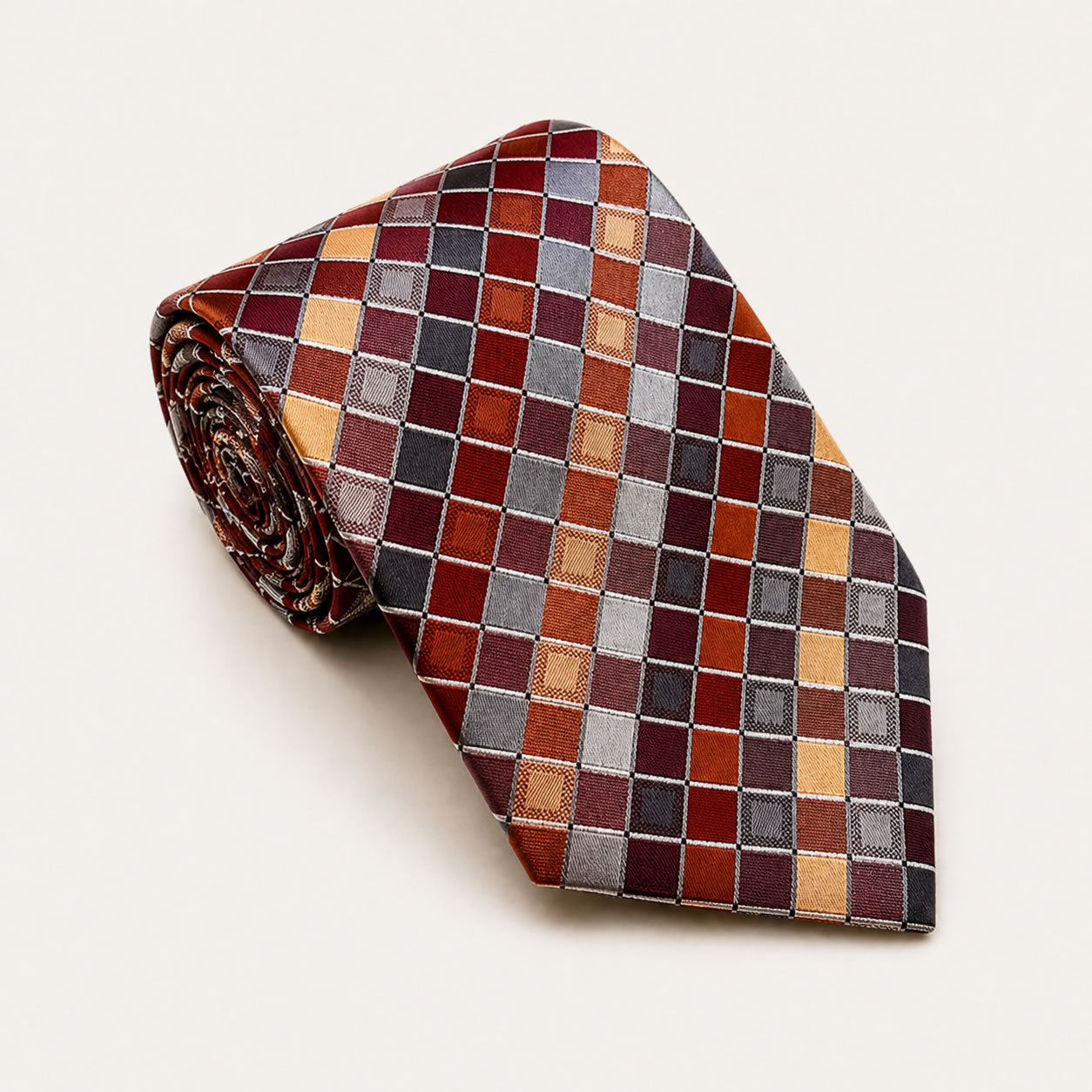 A rolled George Neale maroon and burgundy plaid silk tie.