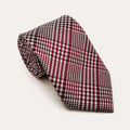 A rolled George Neale burgundy and white plaid silk tie.