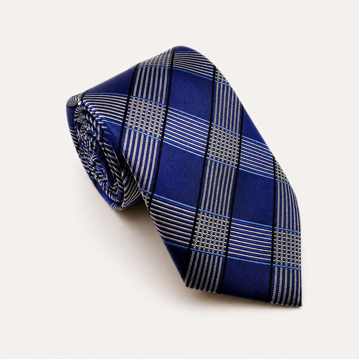 A rolled George Neale navy blue and silver plaid silk tie.