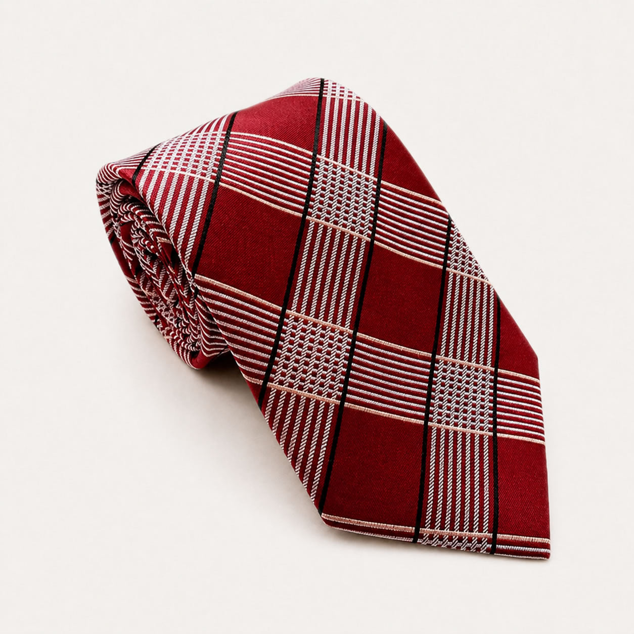 A rolled George Neale red and silver plaid silk tie.