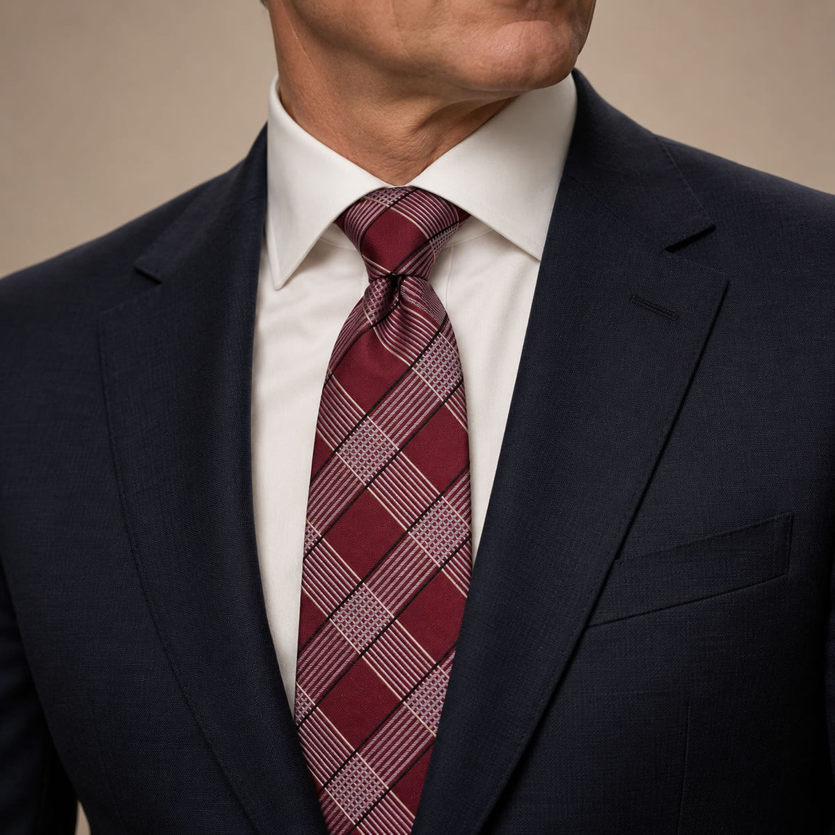 Red and Silver Plaid Silk Tie by George Neale, worn by a model with a suit and shirt