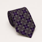 A rolled George Neale purple and green plaid silk tie.