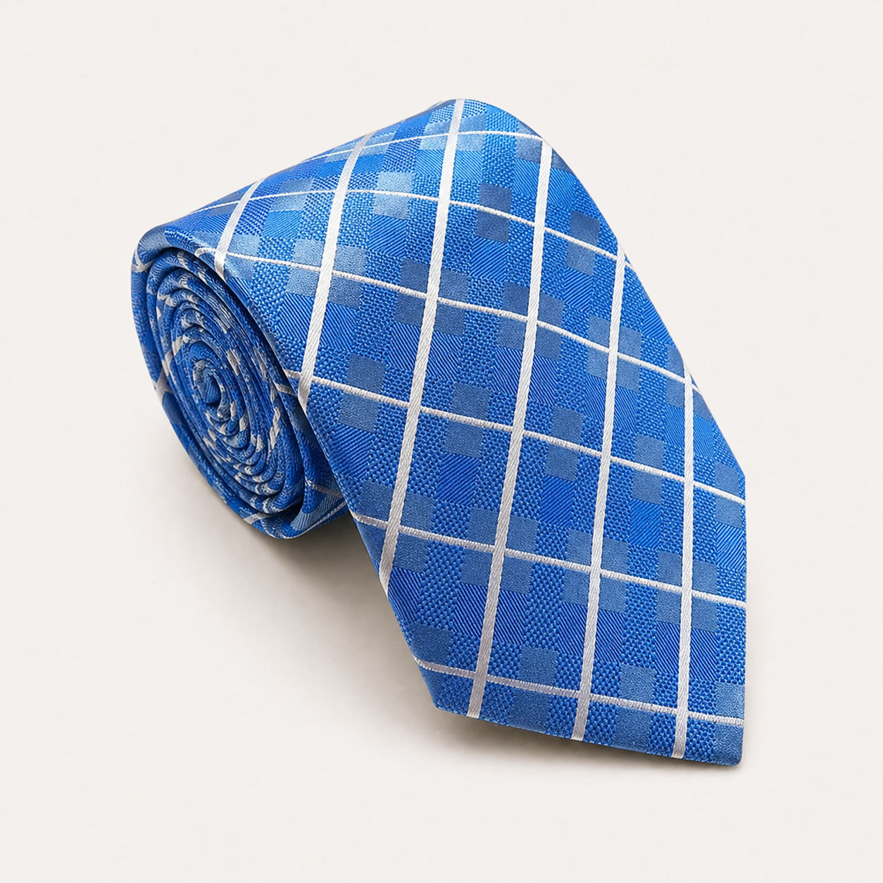A rolled George Neale blue and white plaid silk tie.