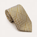 A rolled George Neale gold and white plaid silk tie.