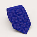 A rolled George Neale mauve plaid silk tie.