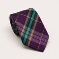 A rolled George Neale purple and green plaid silk tie.