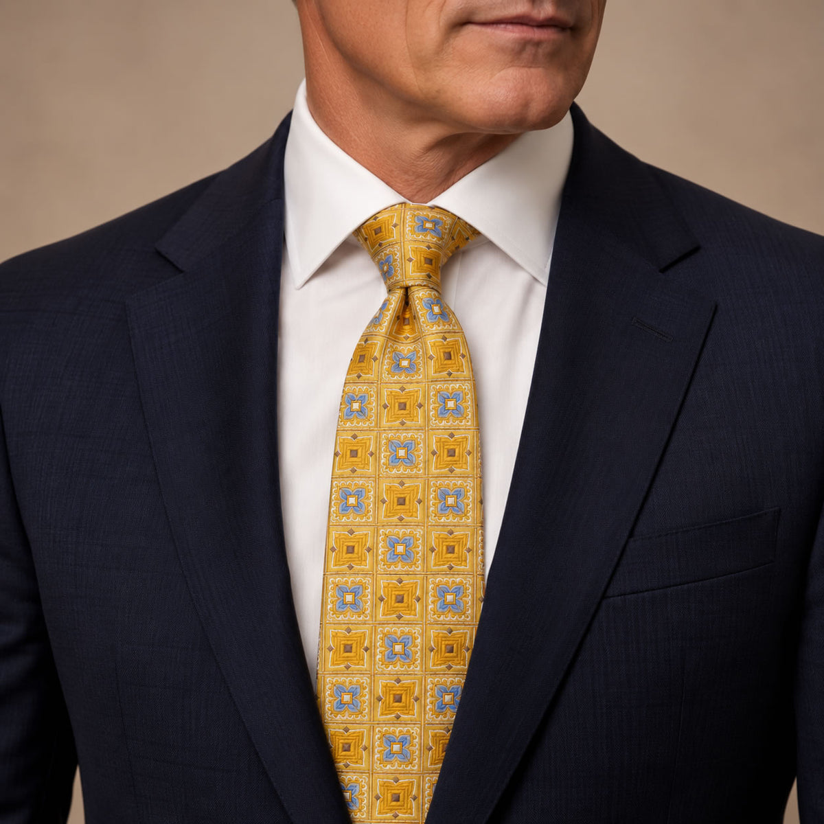 Gold and Blue Plaid Silk Tie by George Neale, worn by a model with a suit and shirt