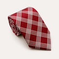 A rolled George Neale red and white plaid silk tie.