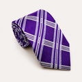 A rolled George Neale purple and silver plaid silk tie.