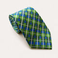 A rolled George Neale green and blue plaid silk tie.
