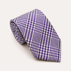 A rolled George Neale purple and white plaid silk tie.