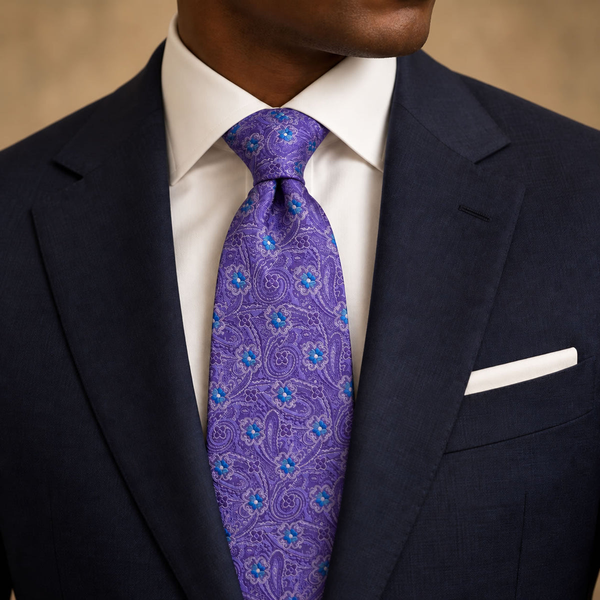 Purple and Blue Floral Silk Tie by George Neale, worn by a model with a suit and shirt