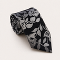 A rolled George Neale black and silver floral silk tie.