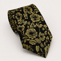 A rolled George Neale black and gold floral silk tie.