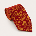 A rolled George Neale red and gold floral silk tie.