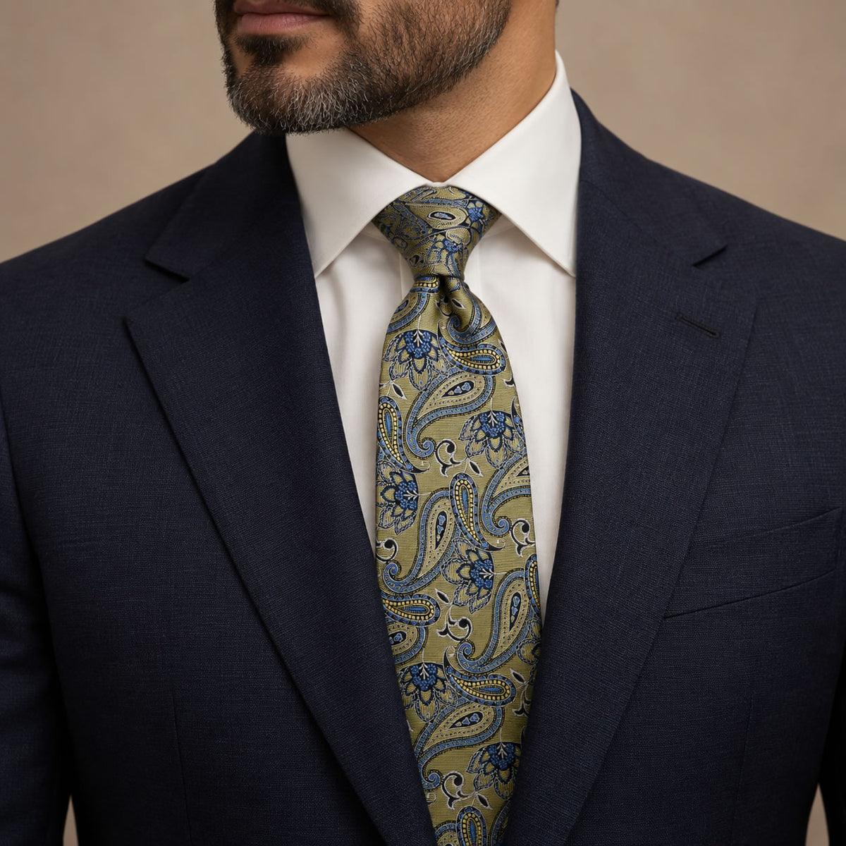 Gold and Blue Floral Silk Tie by George Neale, worn by a model with a suit and shirt