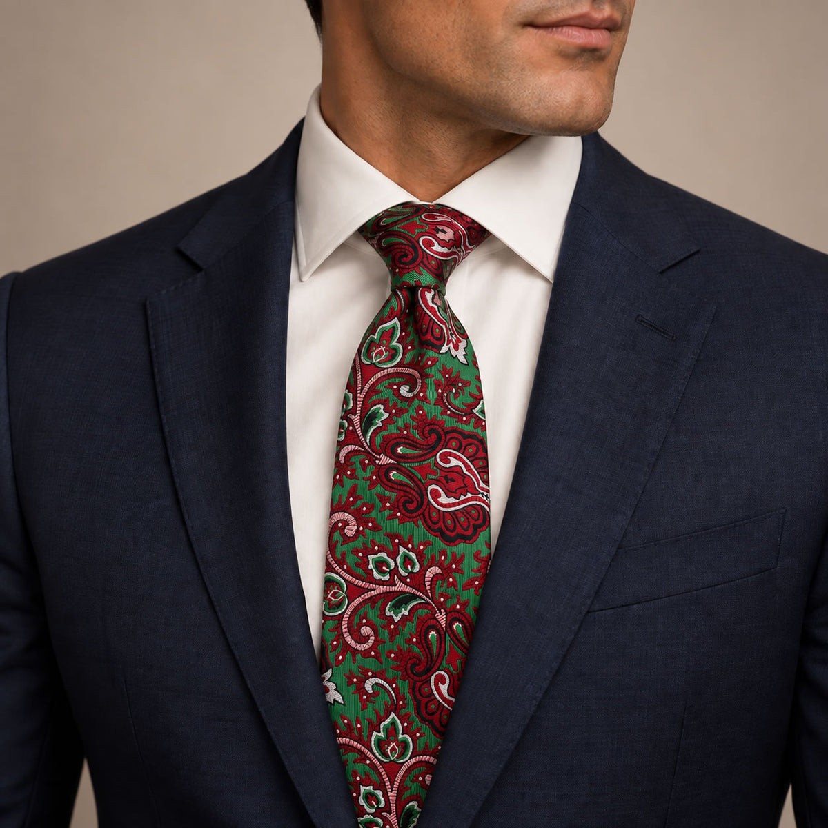 Green and Crimson Floral Silk Tie by George Neale, worn by a model with a suit and shirt
