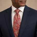 Red and Champagne Floral Silk Tie by George Neale, worn by a model with a suit and shirt