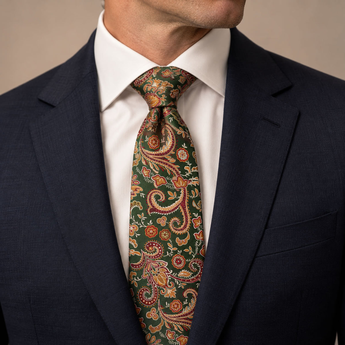 Green and Orange Floral Silk Tie by George Neale, worn by a model with a suit and shirt