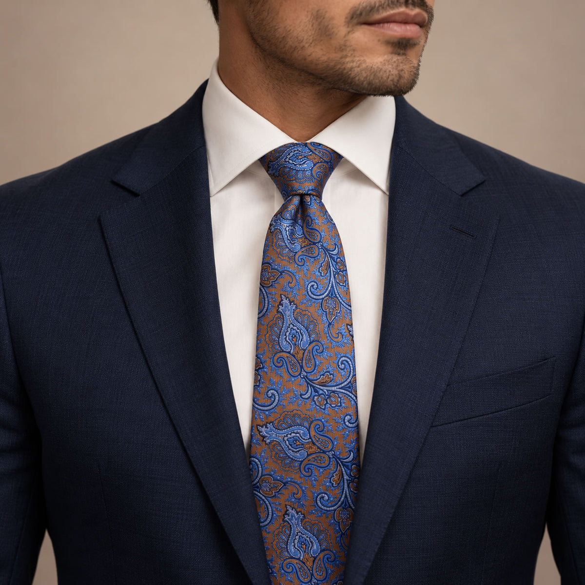 Brown and Blue Floral Silk Tie by George Neale, worn by a model with a suit and shirt
