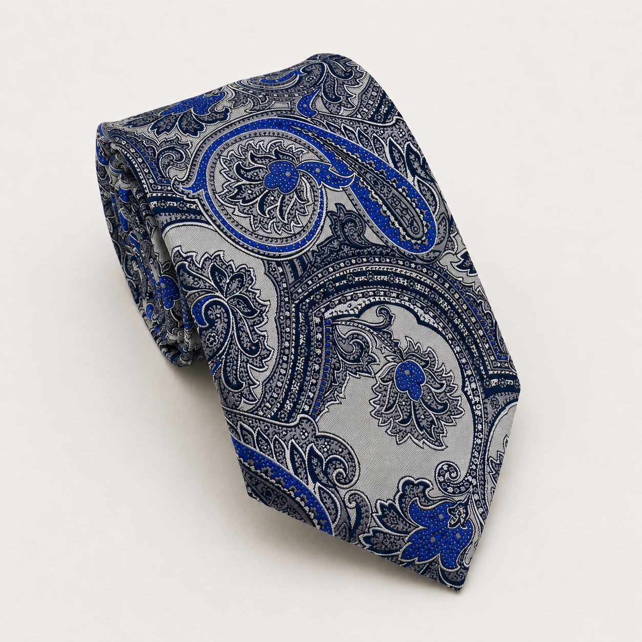 A rolled George Neale silver and blue floral silk tie.