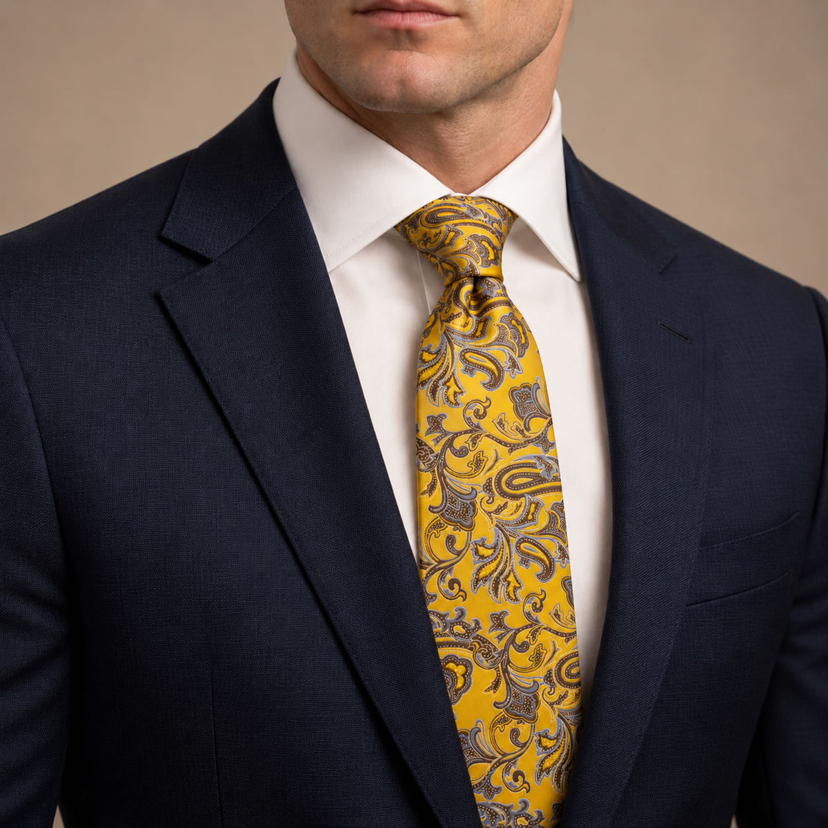 Yellow and Brown Floral Silk Tie by George Neale, worn by a model with a suit and shirt