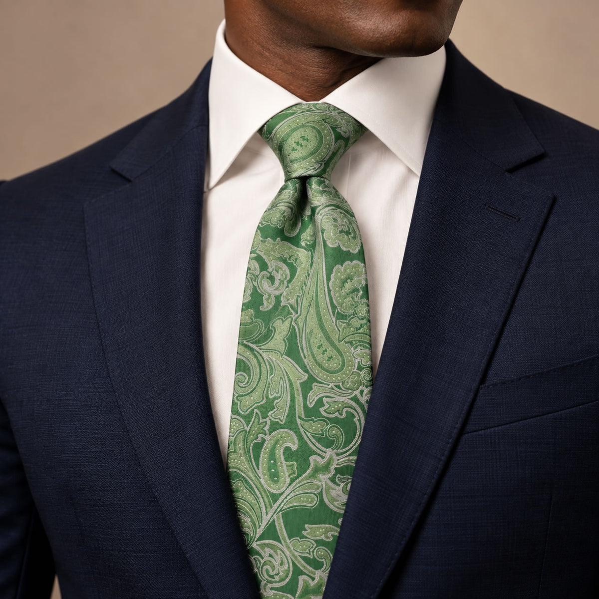 Green Floral Silk Tie by George Neale, worn by a model with a suit and shirt
