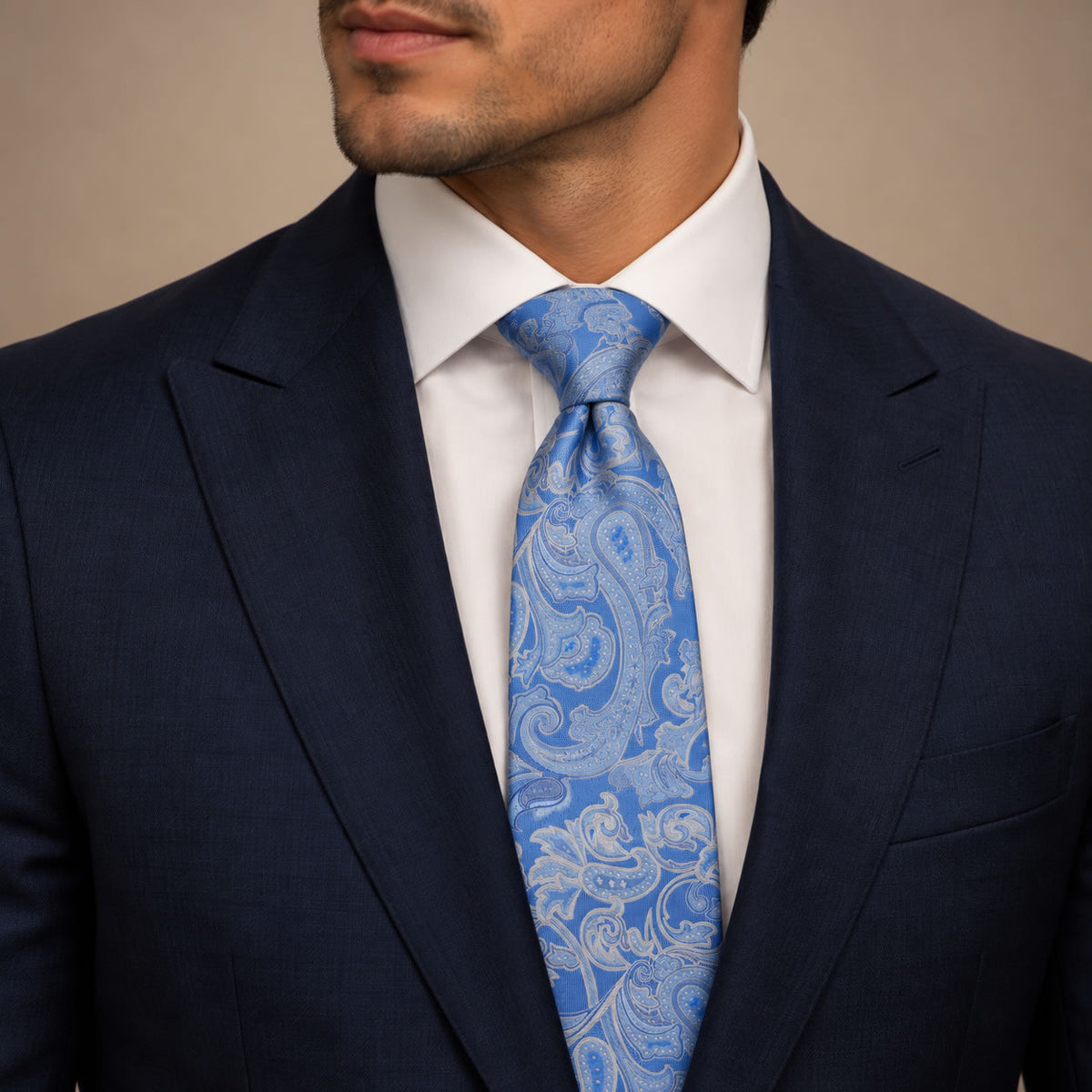 Cobalt Blue Floral Silk Tie by George Neale, worn by a model with a suit and shirt