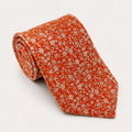 A rolled George Neale orange floral silk tie.