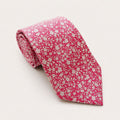 A rolled George Neale hot pink floral silk tie.