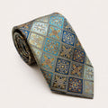 A rolled George Neale silver and blue patterned silk tie.