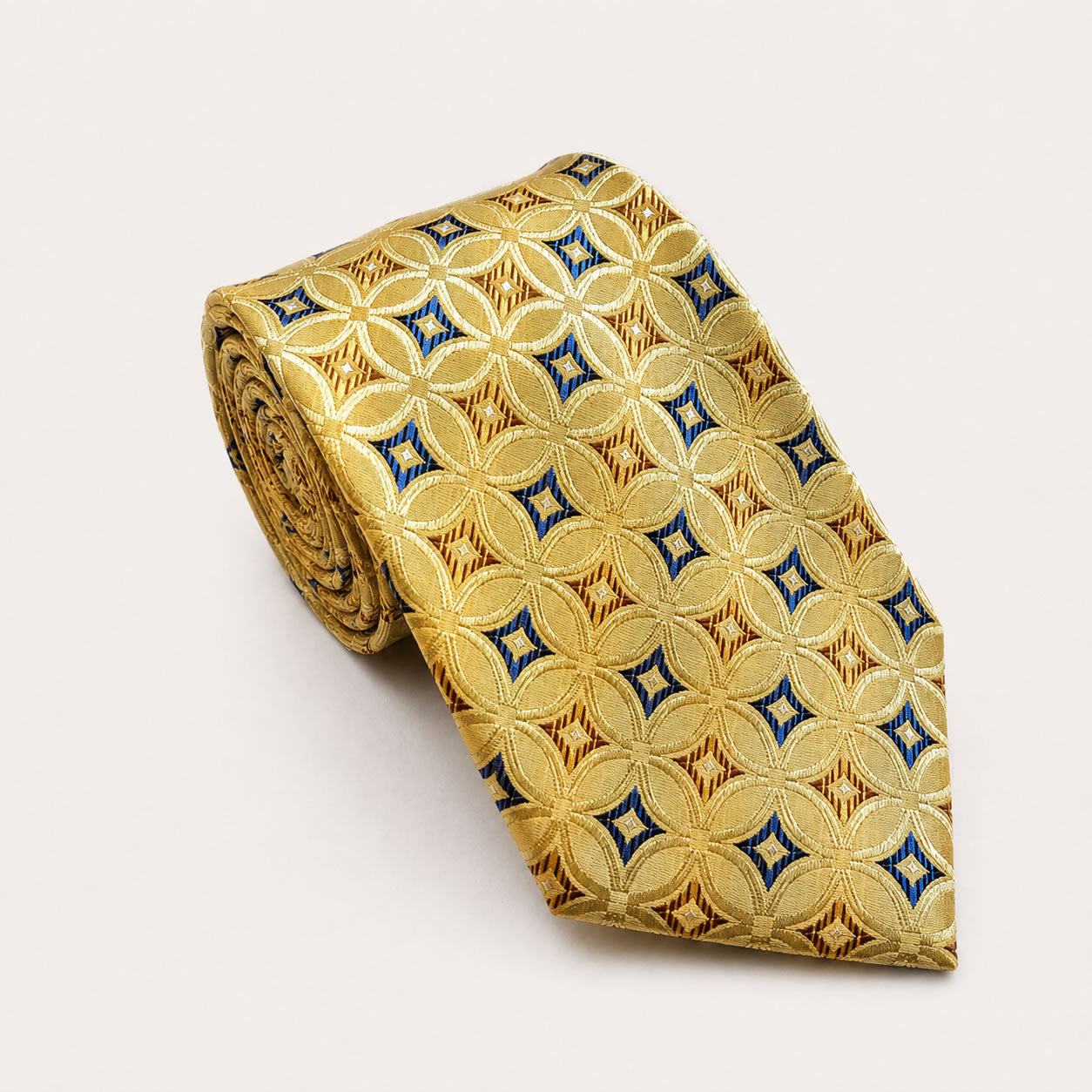 A rolled George Neale gold and blue patterned silk tie.